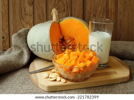 Pumpkin, diced for cooking recipe and a glass of milk