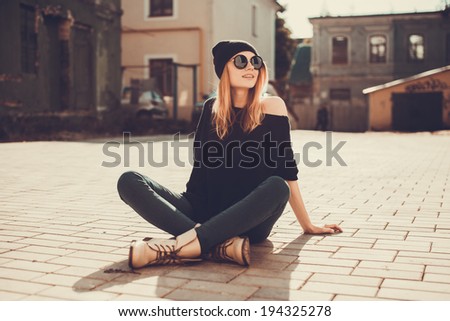 Young beautiful girl posing in the city