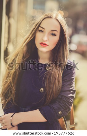 young girl posing in the street