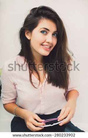 young girl posing in the room smile