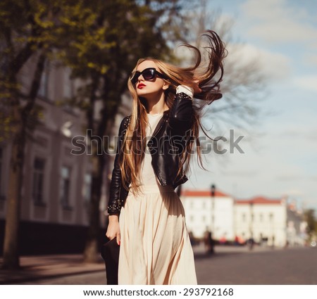 beautiful blonde girl in sunglasses posing with red lips on the street the wind in your hair sun street fashion clothing
