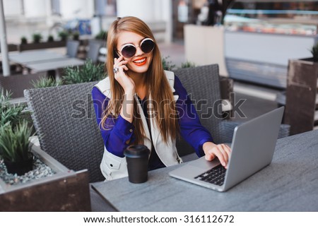 lifestyle modern portrait of young stylish hipster woman walking on street,wearing cute trendy outfit,drinking hot latte,smiling enjoy weekends,travel with backpack,coffee,rest,lounge