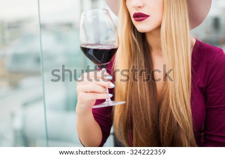 Crop photo,amazing make-up,full lips,red wine,elegant lady,long hairs.Fashion object of sensual lady,tan woman,toned,vintage colors,cool nail polish,nail art,blonde amazing hairstyle,sensual woman