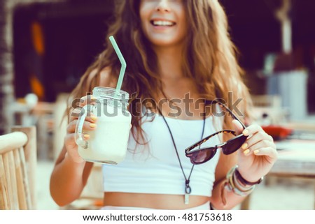 Woman drinking vegetable smoothie after fitness running workout on summer day. Fitness and healthy lifestyle concept, outdoor close up portrait, hipster, juice, tasty, sweet, sunglasses
