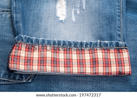 fragments of plaid jeans, denim cloth close-up
