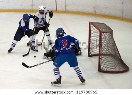 BELGRADE,SERBIA-NOVEMBER 24:Unidentified ice hockey players in action with puck at \