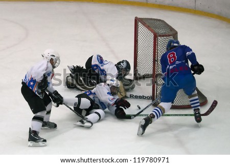 BELGRADE,SERBIA-NOVEMBER 24:Unidentified ice hockey players in action with puck at \