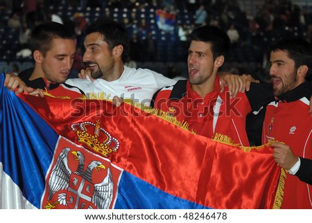 BELGRADE - MARCH 7: Serbian Davis Cup team from left: Troicki, Zimonjic, Djokovic, Tipsarevic celebrate a victory against USA on March 7, 2010 in Belgrade, Serbia. Davis Cup: Serbia won 3-2