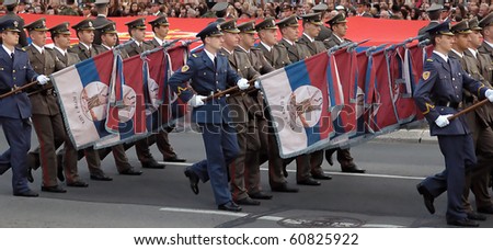 BELGRADE - SEPTEMBER 11th:Promotion of new Serbian army officers,Soldier with old Serbian army flags,September 11, 2010 in Belgrade, Serbia