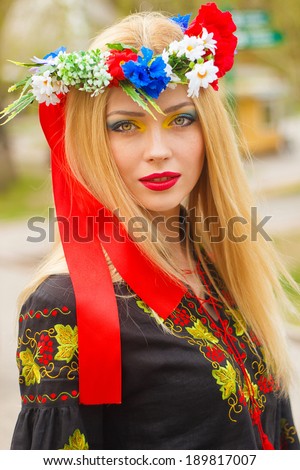 beautiful girl in Ukrainian national dress posing in the Park