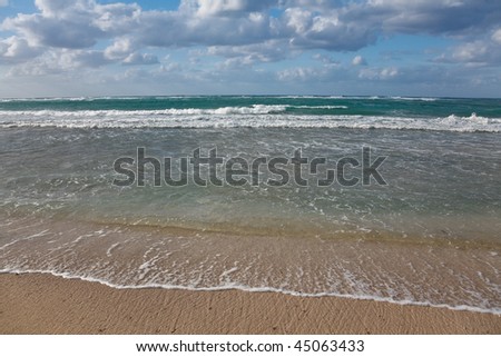 Caribbean seascape  - gentle waves touching the beach, Jibacoa, Cuba