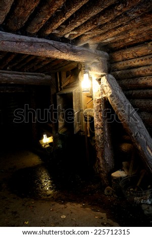 Mine - dungeon - tunnel with vintage lamp and miner tools