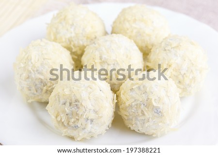 Cheese balls with a tomato cherry inside