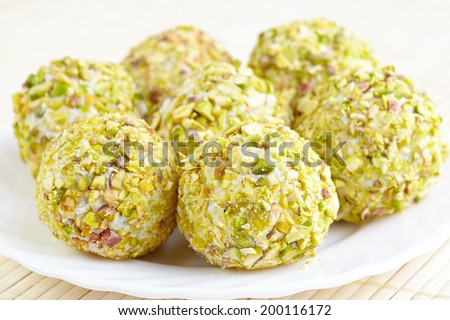 Cheese balls with grapes inside