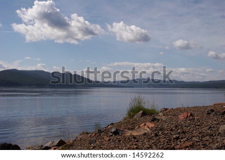 Russia. The river Yenisei. A Krasnoyarsk water basin in a summer sunny day