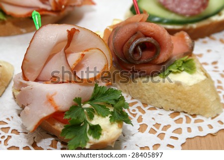 Sandwiches with meat and a fish