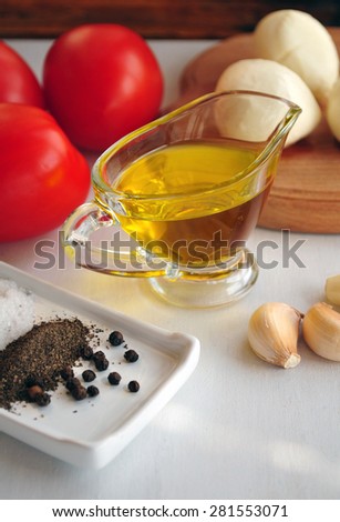 Marinara sauce with olive oil, cheese, tomatoes on white background