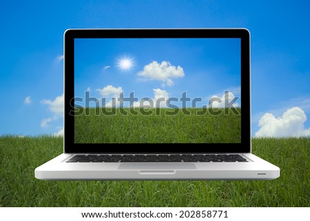 Laptop isolated on nature background