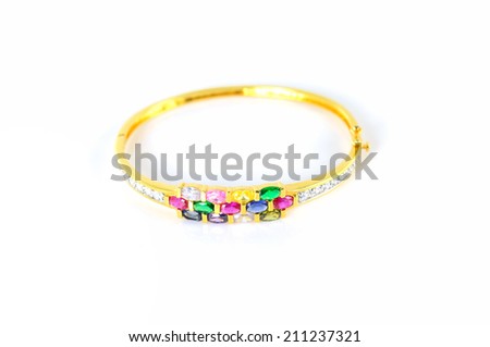 Ring of the jewelry with colourful sapphire on the white background.