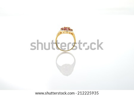 Ring of the jewelry with colourful sapphire on the white background.