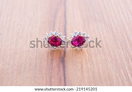 Jewelry accessories - Earrings with sapphire on wood background