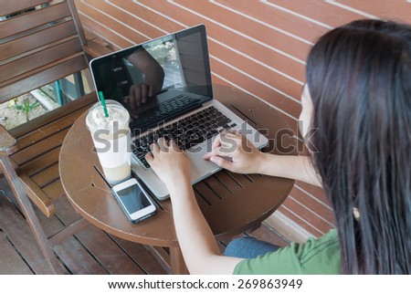 woman work on your laptop in cofee cafe