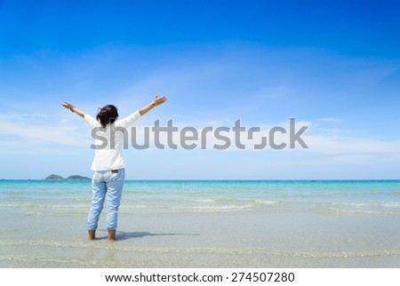 woman walks on a beach