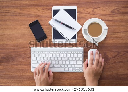 Office workplace with laptop and smartphone and tablet on wood table