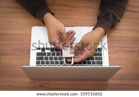 Hacker unlock key with laptop.