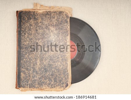 Vintage vinyl record and antique book, audiobook concept
