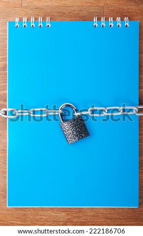 Notebook with chain and padlock, concept of protection of personal information