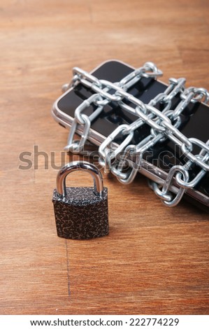Telephone with chains and lock, concept of protection of personal information