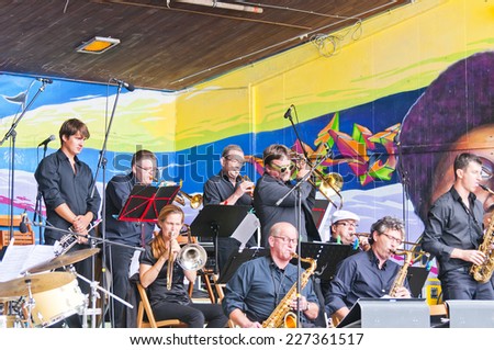 MONTREUX, SWITZERLAND - SEPTEMBER 21, 2014: Musicians big band Tonis play on the street scene town Montreux. The big band Tonis - famous Swiss jazz band
