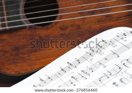 Music notes and vintage guitar