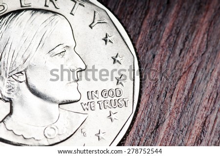 In God we trust. Inscription on the coin of one dollar