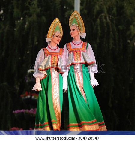 Orel, Russia, August 4, 2015: Orlovskaya Mozaika folk festival, two girls in Russian dresses and kokoshniks dancing