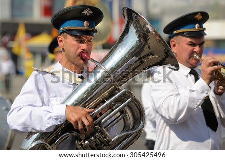 Orel, Russia - August 5, 2015: brass band musicians marching in parade