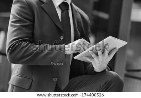 Business man working with a digital tablet. black and white