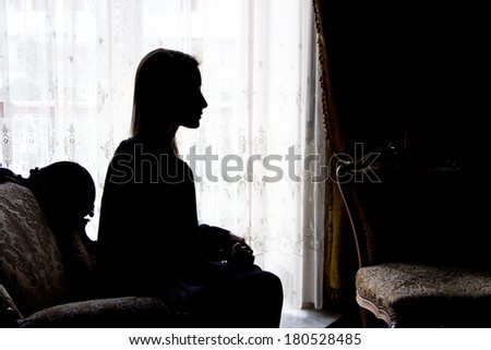 silhouette woman at home