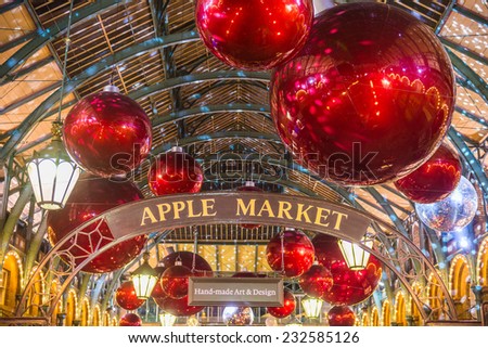 Apple market in Covent Garden in London NOV 16, 2014. The modern colorful Christmas lights attract and encourage people to the market.