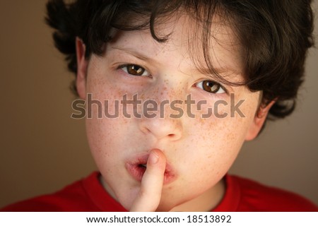 Boy asking for silence