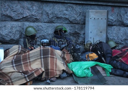 KIEV, UKRAINE - FEB 19, 2014: Protesters are resting at the morning after hard confrontation with police on Independance square.