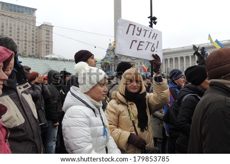 2811 KYIV, UKRAINE - MARCH 02, 2014: Women stand with placard Putin get out! during  Sunday rally against the Russian invasion of Crimea.