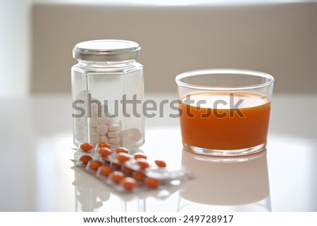 Vitamin tablets and vegetable juice