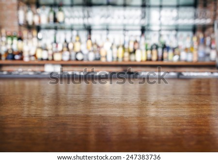 Top wooden table with Bar Blurred Background