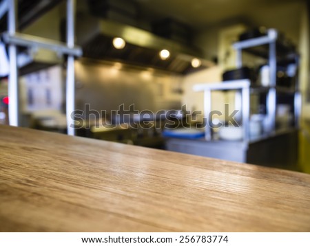 Top of Wooden counter with Blurred Kitchen Restaurant Interior Background