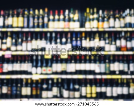 Wine Liquor bottle on shelf,  Blurred Bar Restaurant background