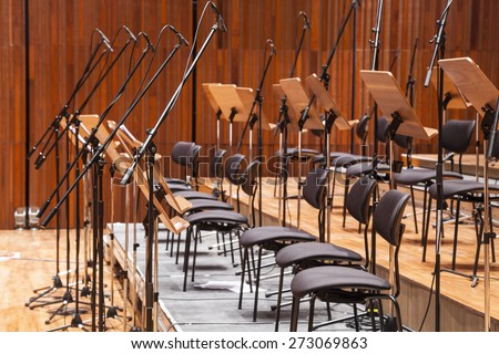 Orchestra stage with chairs and microphone