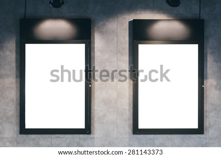 Mock up poster frame with spotlight on wall