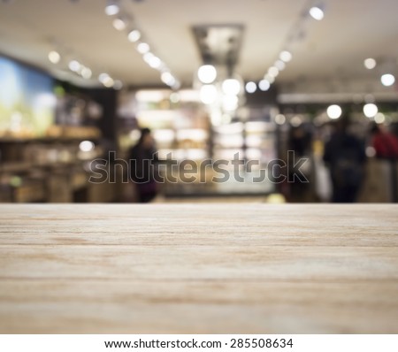 Table top with Blurred Retail shop Interior decoration background